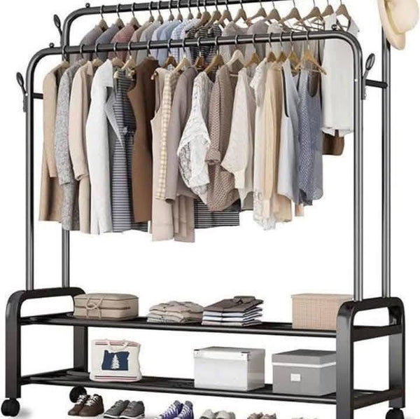 Clothing rack with clothes and shelves on a white background