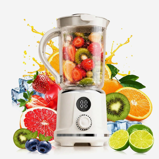 A white portable blender with a clear pitcher filled with fruit, surrounded by fresh strawberries, kiwi, orange, grapefruit, blueberries, and limes on a white background with juice splashes.