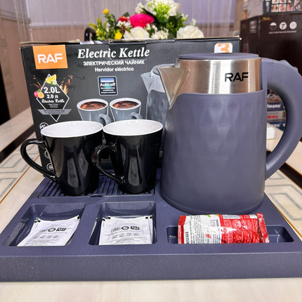 RAF electric kettle with two mugs and tea bags on a tray, with packaging in the background.