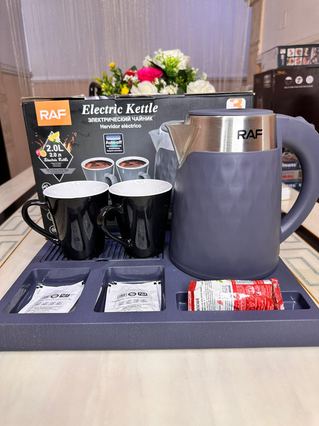 RAF electric kettle with two mugs and tea bags on a tray, with packaging in the background.