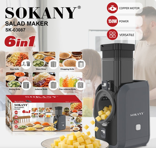 Sokany 6-in-1 salad maker SK-03087 in dark gray, shown alongside its retail box, loose yellow cheese cubes, and feature callouts for copper motor, 150W power, and versatility. The background features a softly blurred lifestyle scene of a person preparing food.